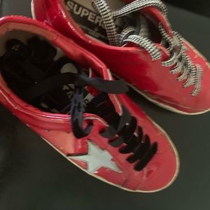 Golden Goose patent tennis shoes gladiator style